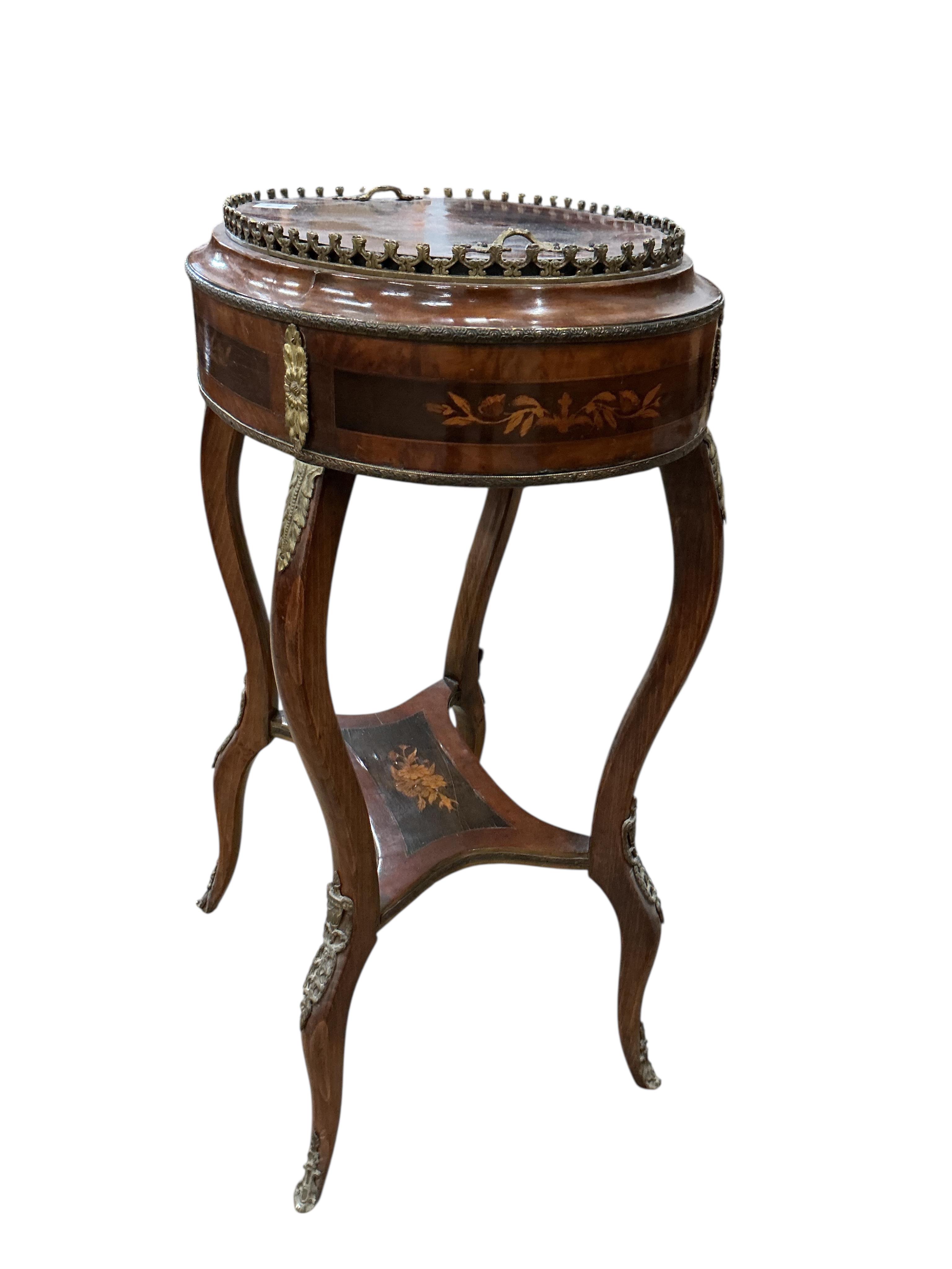 A French Louis XVI style oval gilt metal mounted marquetry inlaid walnut and beech jardiniere table, width 56cm, depth 38cm, height 80cm